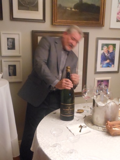 Host Tom Uncorking the Champagne!